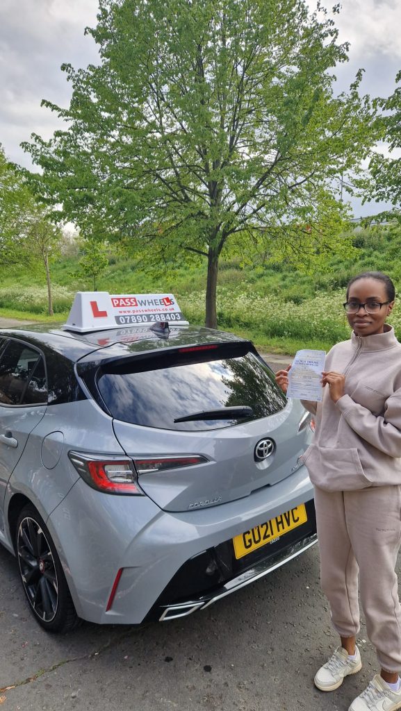 Pass Wheels pupil holding their practical driving test pass certificate
