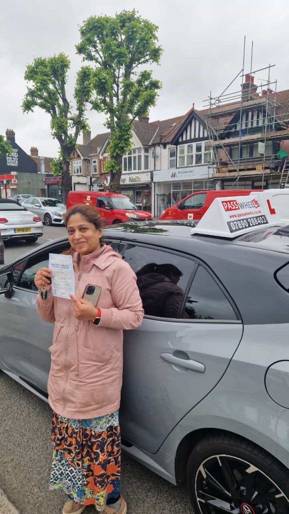 Pass Wheels pupil holding their practical driving test pass certificate