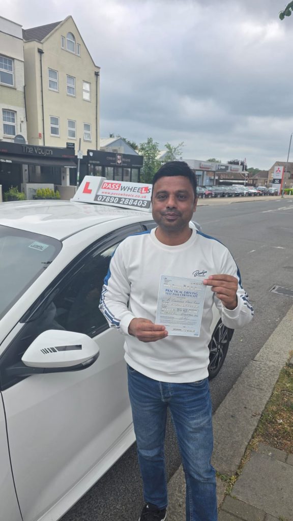 Pass Wheels pupil holding their practical driving test pass certificate
