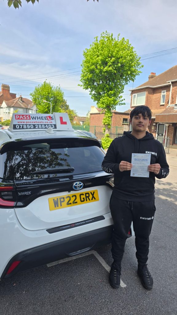 Pass Wheels pupil holding their practical driving test pass certificate