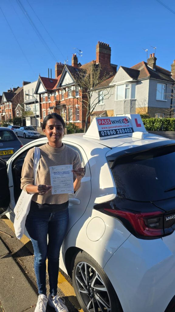 Pass Wheels pupil holding their practical driving test pass certificate