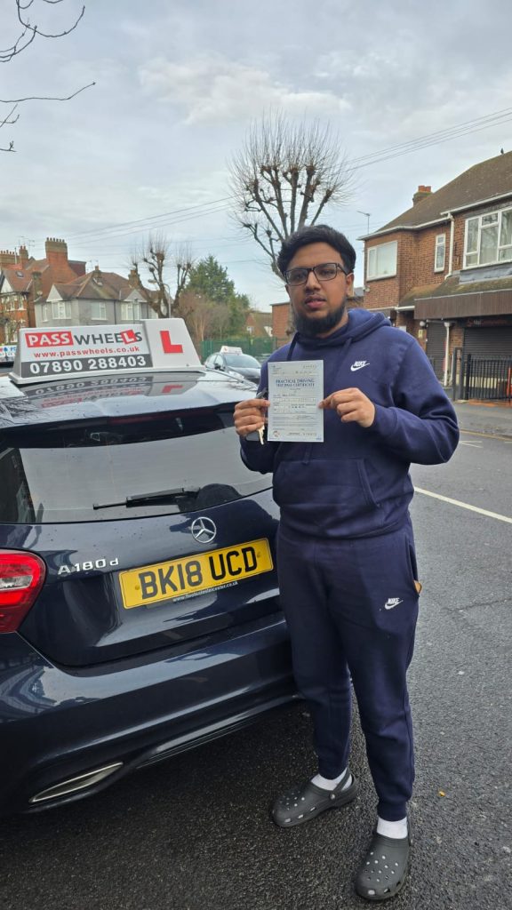 Pass Wheels pupil holding their practical driving test pass certificate