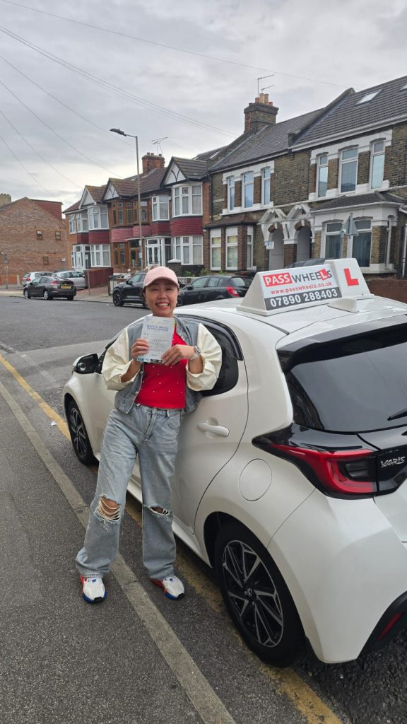 Pass Wheels pupil holding their practical driving test pass certificate