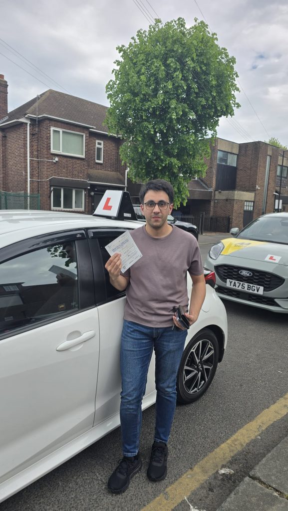 Pass Wheels pupil holding their practical driving test pass certificate