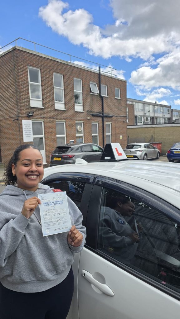 Pass Wheels pupil holding their practical driving test pass certificate