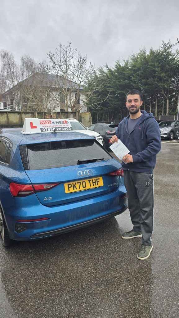 Pass Wheels pupil holding their practical driving test pass certificate