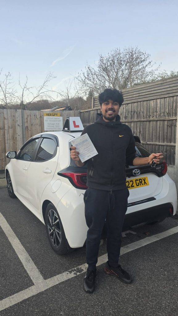 Pass Wheels pupil holding their practical driving test pass certificate