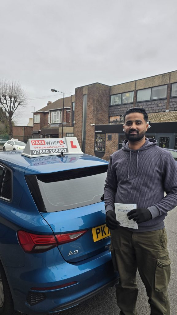 Pass Wheels pupil holding their practical driving test pass certificate