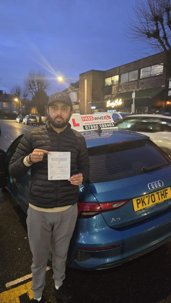 Pass Wheels pupil holding their practical driving test pass certificate