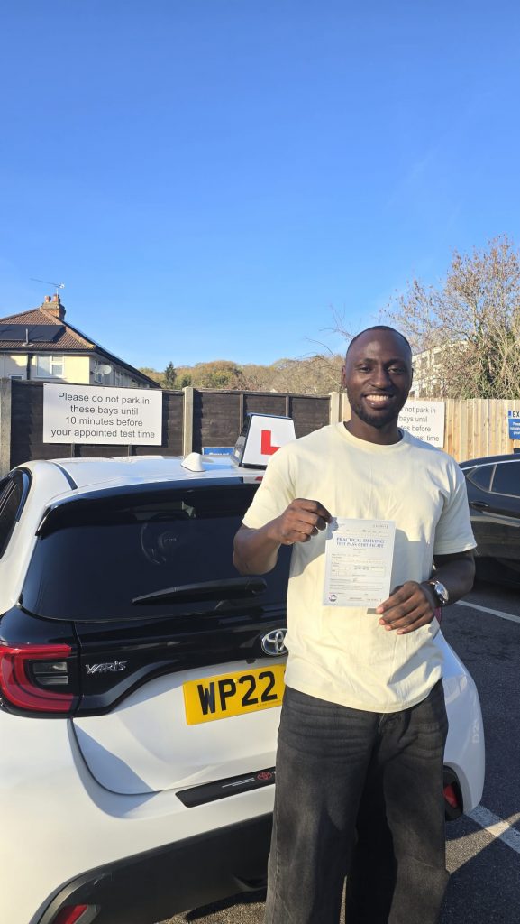 Pass Wheels pupil holding their practical driving test pass certificate